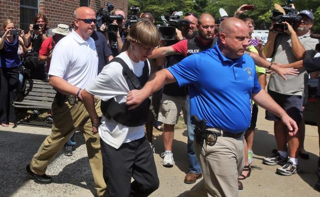 Brittany Randolph/The StarShelby Police escort Dylann Roof off premises in Shelby on June 18, 2015.