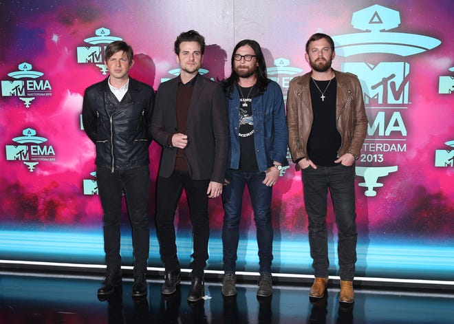 In this Nov. 10, 2013 file photo, from left, Matthew Followill, Jared Followill, Nathan Followill and Caleb Followill of the band Kings of Leon pose for photographers upon arrival at the 2013 MTV Europe Music Awards, in Amsterdam, Netherlands. The Kings of Leon took it easy this year after finishing up their international tour for their 2013 album "Mechanical Bull," but the Grammy-winning family rock group is ready to start 2016 with a bang, literally. They are headlining the New Year's Eve celebrations in downtown Nashville, Tenn., where they've made their home for 15 years. (Photo by Joel Ryan/Invision/AP, File)