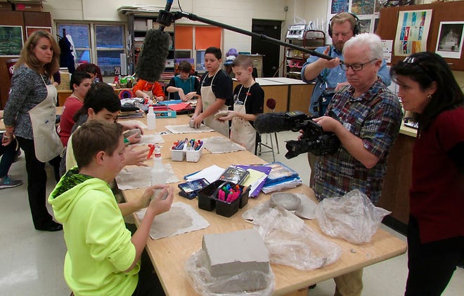 Marlton Middle School students in Kate Sampson’s sculpture class are filmed by NJTV’s "Classroom Close-up" crew before the second annual Empty Bowls fundraising event on Friday, Dec. 18, 2015.