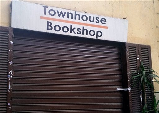 A door to the Townhouse Bookshop is sealed after a raid on the art house, in downtown Cairo, Egypt, Wednesday, Dec. 30, 2015. Two people working at Townhouse say officials raided their venue, taking computers and other items before closing it Monday night. A raid the next day on a publishing house were the latest in a crackdown on Egypt"™s art scene -- which is often frequented by opposition activists -- ahead of the Jan. 25 anniversary of the 2011 uprising. (AP Photo/ Maram Mazen)