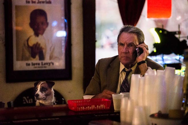 Josh Galemore/Savannah Morning News - Two regulars a man who goes by the name of James Bond and his dog Buster enjoy a drink and popcorn at Pinkie Masters.