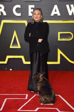 Carrie Fisher poses for photographers Dec. 16 at the European premiere of the film 'Star Wars: The Force Awakens ' in Londo. The Associated Press