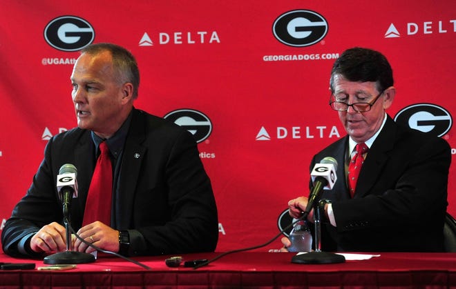 Mark Richt, left, speaks to the media as UGA Athletic Director Greg Greg McGarity listens during a press conference at Stegeman Coliseum on Monday, Nov. 30, 2015 in Athens, Ga. 
(Richard Hamm/Staff) OnlineAthens / Athens Banner-Herald