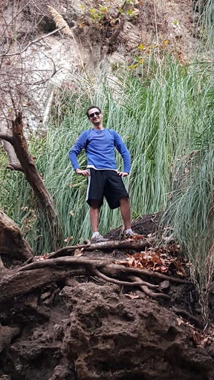 This Sunday, Dec. 20, 2015 photo provided by Lavinia Lumezanu shows Jarone Ashkenazi on the Escondido Canyon Trail in Malibu, Calif. His new year's resolution is to break out and get more active in things to do around his native Los Angeles. (Lavinia Lumezanu via AP)