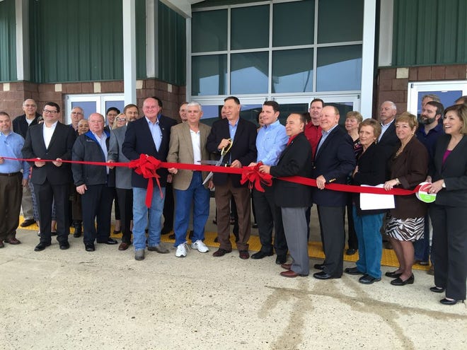 Officials cut ribbon at the 4-H building located at the Lamar-Dixon Expo Center.