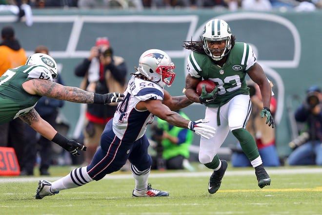 The Patriots Dont’a Hightower attempts to tackle the Jets' Chris Ivory during last Sunday's game. Hightower has battled injuries thoughout the season.