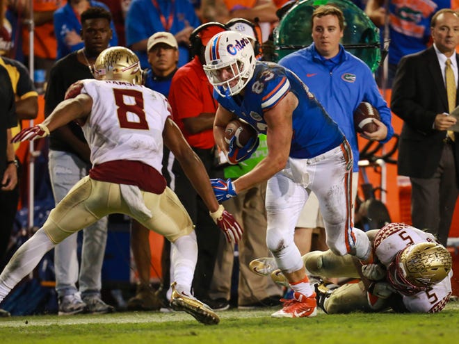 In this Nov. 28, 2015 file photo, Florida Gators tight end Jake McGee (83) picks up a first down during the second half of the Gators' 27-2 loss against the Florida State Seminoles at Ben Hill Griffin Stadium in Gainesville.