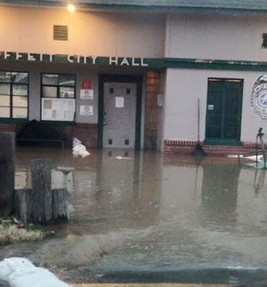 Floodwater covers the floor of Moffett City Hall and Police Department. Police, the Red Cross and volunteers used sandbags and railroad ties to redirect the water flow to a field behind the building, said Moffett Police Chief Riley Brooks on Wednesday, Dec. 30, 2015. (Submitted photo)