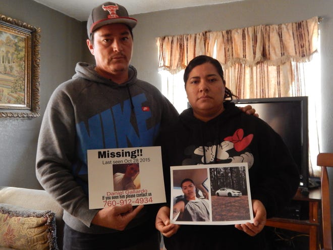 Daniel Gallardo Sr. and Rosalinda Gallardo hold photos of their 19-year-old son, who has been missing since Oct. 28. Daniel Octavio Gallardo was last heard from on the day he was supposed to report to his new job in Truckee. Jose Quintero, Desert Dispatch