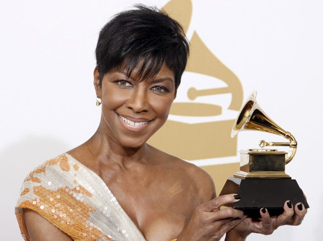 FILE - In a Sunday, Feb. 8, 2009 file photo, Natalie Cole holds the best instrumental arrangement accompanying vocalist award backstage at the 51st Annual Grammy Awards, in Los Angeles. Cole, the daughter of jazz legend Nat "King" Cole who carried on his musical legacy, died Thursday night, Dec. 31, 2015, according to publicist Maureen O'Connor. She was 65. (AP Photo/Matt Sayles, File)