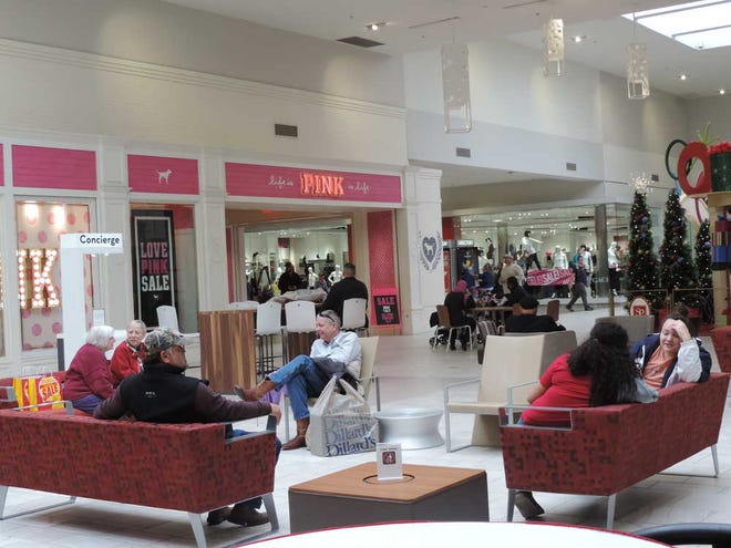 Shoppers at the South Plains Mall filled stores on New Year's Day, despite the mall's roof collapse in the north wing.