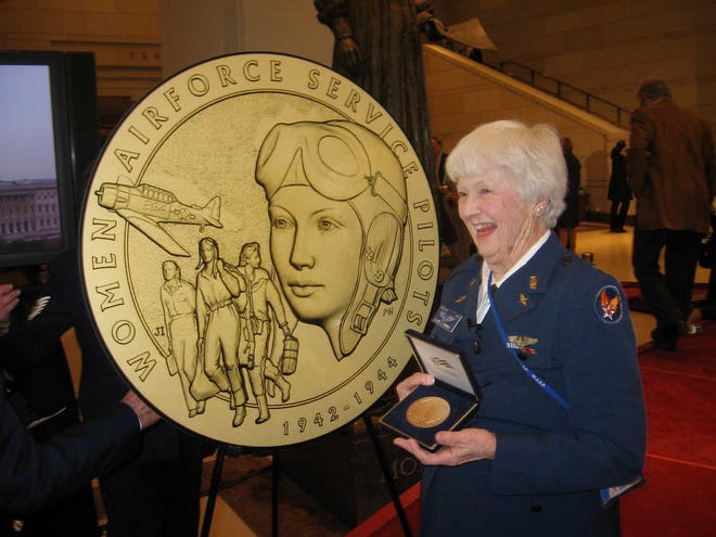 This photo provided by the Harmon family shows Elaine Harmon at the Congressional Gold Medal ceremony on Capitol Hill in Washington in 2010. The ashes of World War II veteran Harmon are sitting in a closet in her daughter's home, where they will remain until they can go where her family says is her rightful resting place: Arlington National Cemetery.