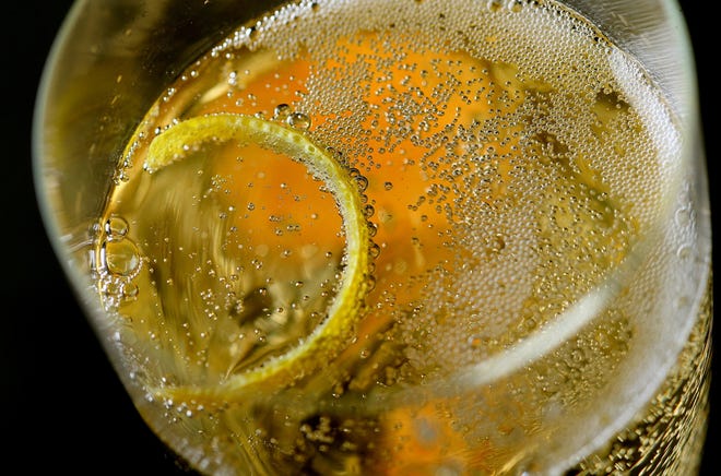 Classic Champagne Cocktail, served with a sugar cube on the bottom and the lemon rind on top. 

David Carson/St. Louis Post-Dispatch/TNS