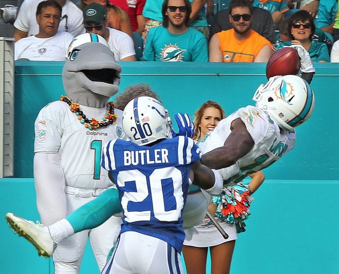 Miami receiver Jarvis Landry makes a one-handed grab against Indianapolis' Darius Butler last Sunday.