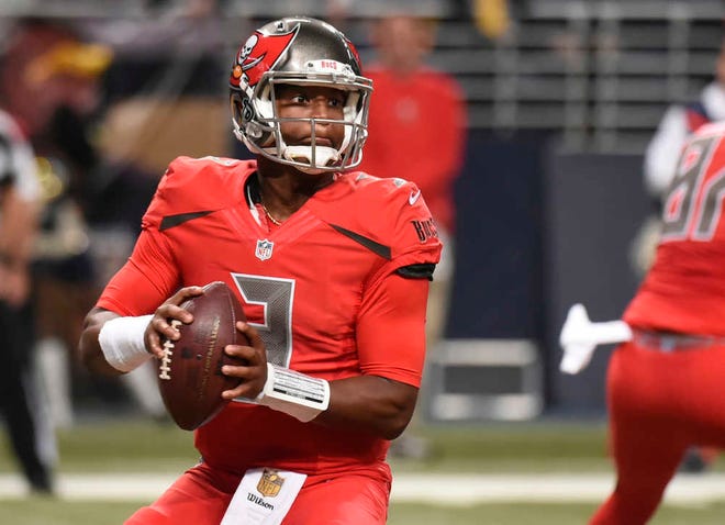 Tampa Bay Buccaneers quarterback Jameis Winston drops back to pass against the St. Louis Rams on Dec. 17 in St. Louis. Winston will finish his rookie season doing something that Marcus Mariota simply could not: Playing in all 16 regular-season games. (AP Photo/L.G. Patterson)