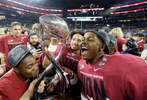Alabama players celebrate after the Cotton Bowl NCAA college football semifinal playoff game against Michigan State, Thursday, Dec. 31, 2015, in Arlington, Texas. Alabama won 38-0 to advance to the championship game. (AP Photo/LM Otero)