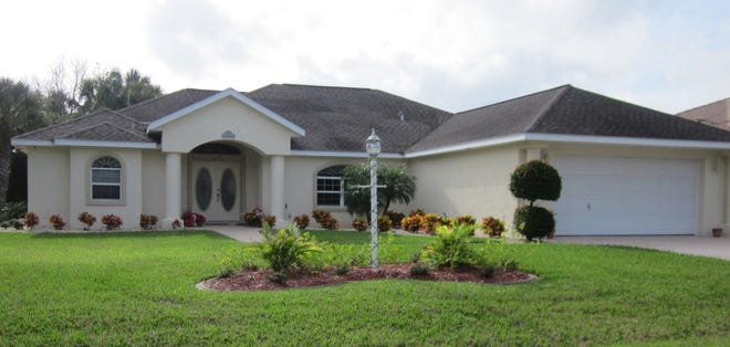 This house on Cadillac Place on Palm Coast has three bedrooms and 2 1/2 baths in 2,413 square feet of living space. It also has a bonus room and a screened and heated pool. It was built in 2000 and sold for $299,000.