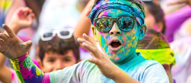 A Color Vibe 5K run planned for Palm Coast's Town Center later this month is a family-friendly, untimed jog that happens to have multiple "color stations" manned by people who will dust joggers with colored cornstarch powder. PHOTO PROVIDED/COLOR VIBE