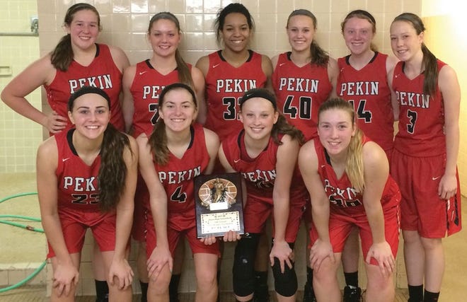 The Pekin girls basketball team shows off the plaque it received for finishing in third place at the Dixon Holiday Tournament. The Lady Dragons won three of four games in the three-day competition.