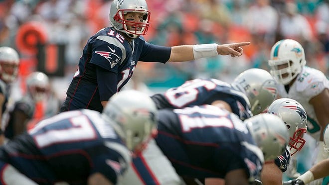 New England Patriots quarterback Tom Brady (12) at Sun Life Stadium in Miami Gardens, Florida on September 7, 2014. (Allen Eyestone / The Palm Beach Post)