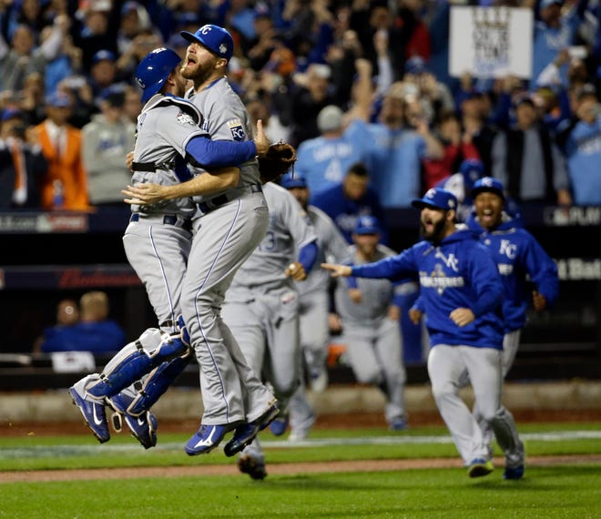 Closer Wade Davis and catcher Drew Butera celebrate the Kansas City Royals' World Series-clinching 7-2 win over the Mets in Game 5. THE ASSOCIATED PRESS