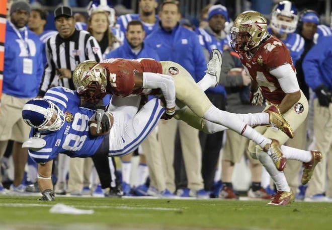 Times-Union and Associated Press photos Florida State's Ramsey hits Duke's Braxton Deaver during the ACC Championship game in 2013. The Seminoles' free safety would complement Dante Fowler on the Jaguars' defense.