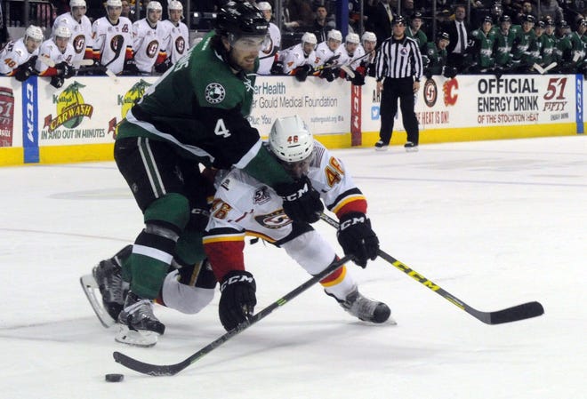The Heat's Bill Arnold is blocked by the Texas Stars' Stephan Johns during the overtime period on Saturday at Stockton Arena. CALIXTRO ROMIAS/THE RECORD
