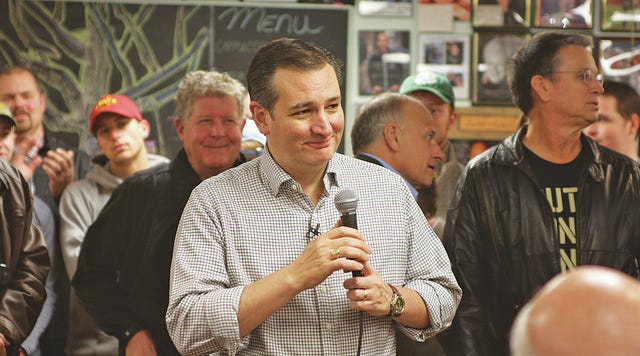 Ted Cruz, center, cracks a joke at his “Cruzin’ to Caucuses” tour in Boone Monday morning. Cruz has been the Iowa Republican front-runner since the beginning of December, and has gained a 4 percentage point advantage over Donald Trump. Cruz was in Boone to kick off his 28-county trip through Iowa. (Photo by Matthew DeWitt/Boone News-Republican)