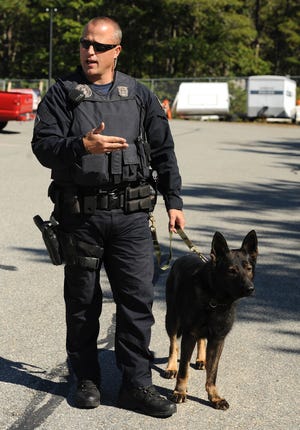 Yarmouth police Officer Michael Kramer talks about his dog, Kosmo, one of three K-9s at the Yarmouth Police Department. Kosmo is retiring after an on-the-job injury. 

Merrily Cassidy/Cape Cod Times