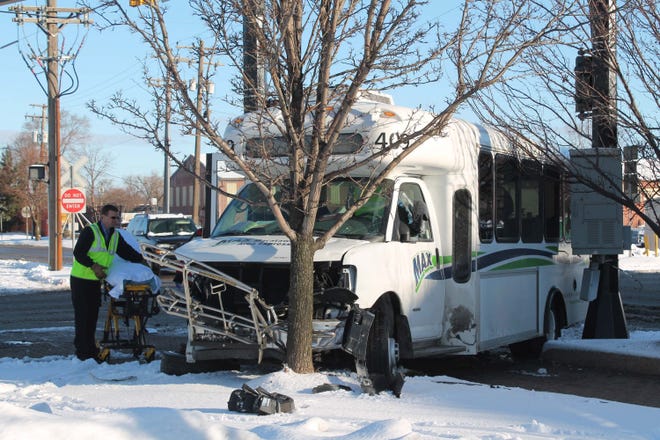 A Macatawa Area Express bus crashed into a tree after being struck by a pickup truck, the driver of which ran a red light Monday, Jan. 4, 2016. Curtis Wildfong/Sentinel staff