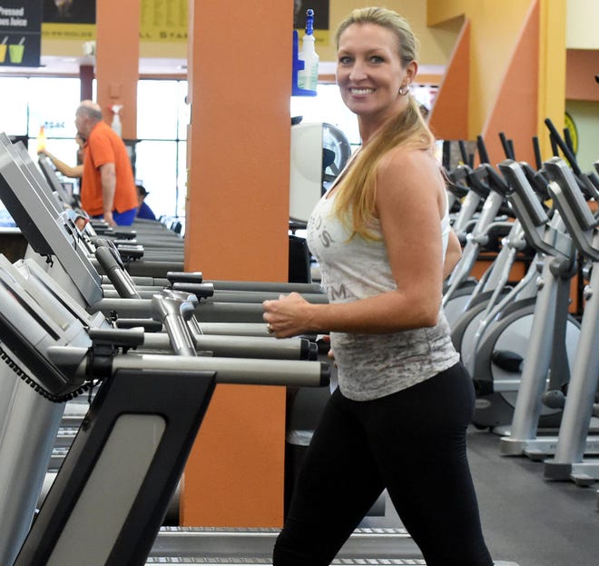 Marlo Alleva uses a treadmill for a brisk walk.