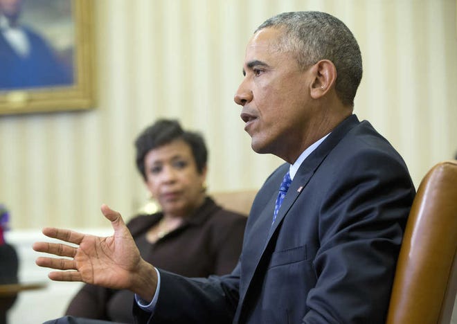 Attorney General Loretta Lynch listens as President Barack Obama speaks in the Oval Office of the White House in Washington, Monday, Jan. 4, 2016, during a meeting with law enforcement officials to discuss executive actions the president can take to curb gun violence. The president is slated to finalize a set of new executive actions tightening U.S. gun laws, kicking off his last year in office with a clear signal that he intends to prioritize one of the country's most intractable issues. (AP Photo/Pablo Martinez Monsivais)