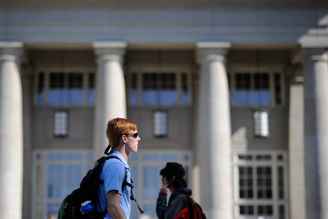 Students walk past the Miller Learning Center on the campus of the University of Georgia on Thursday, Sept. 17, 2015, in Athens, Ga. (AJ Reynolds/Staff, @ajreynoldsphoto)
