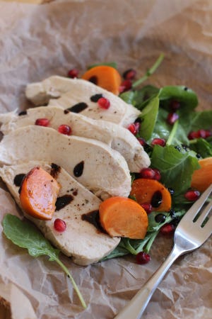 Wine-poached Chicken Breasts from today's recipe are moist and tender every time. (AP Photo/Matthew Mead)
