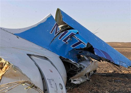 This photo released by the Prime Minister's office shows the tail of a Metrojet plane that crashed in Hassana, Egypt on Saturday, Oct. 31, 2015.