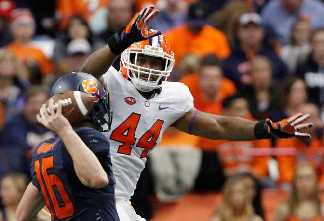 Clemson's B.J. Goodson tries to blocks a pass thrown by Syracuseís Zack Mahoney in the third quarter of a game in Syracuse, N.Y. on Nov. 15. Clemson had lost eight starters off last year's No. 1 defense in the country. But the Tigers weren't too worried knowing linebackers B.J. Goodson and Ben Boulware were returning
