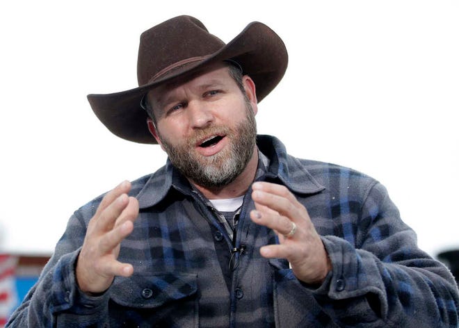 Ammon Bundy, one of the sons of Nevada rancher Cliven Bundy, speaks during an interview at Malheur National Wildlife Refuge, Tuesday, Jan. 5, 2016, near Burns, Ore. Law enforcement had yet to take any action Tuesday against a group numbering close to two dozen, led by Bundy and his brother, who are upset over federal land policy. (AP Photo/Rick Bowmer)