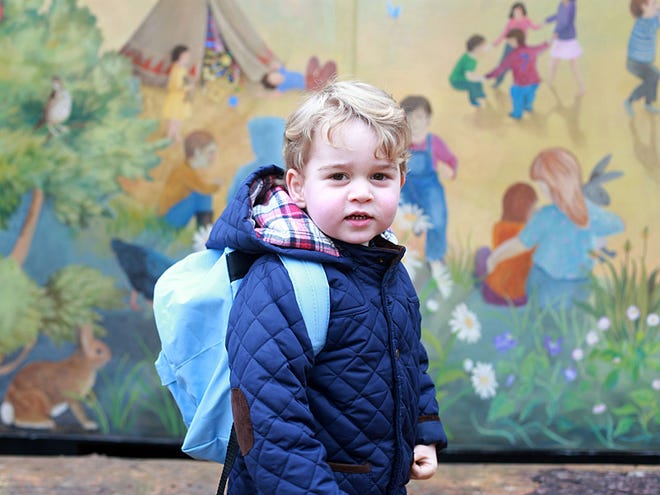 In this handout photograph provided by Kensington Palace on Wednesday, Jan. 6, 2016, taken by Kate, The Duchess of Cambridge, Britain's Prince George poses on his first day at the Westacre Montessori nursery school near Sandringham in Norfolk, England.