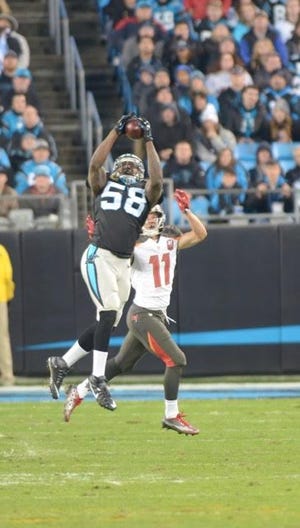 Thomas Davis makes an interception in a 38-10 victory over the Tampa Bay Buccaneers on Sunday, Jan. 3 in Charlotte.