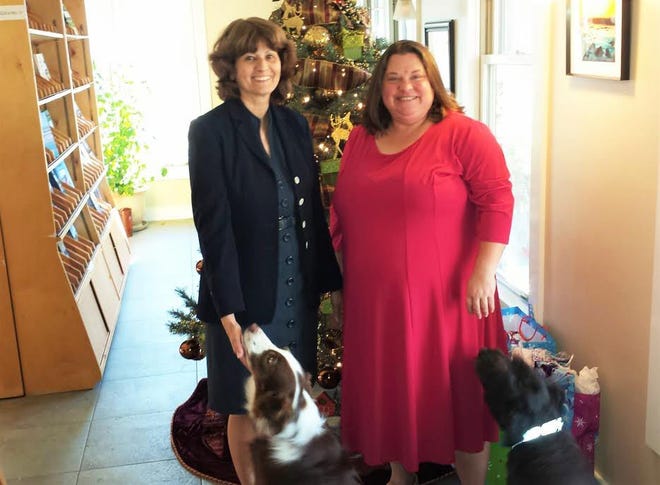 Ogunquit Chamber of Commerce President Karen Arel (left) and Vice-President Frances Reed, with canine friends Mandy (left) and Rusty.

Photo by Jim Kanak