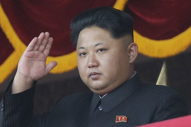 In this Oct. 10, 2015, file photo, North Korean leader Kim Jong Un gestures as he watches a military parade in Pyongyang, North Korea. North Korea said on Wednesday, Jan. 6, 2016, it has conducted a hydrogen bomb test.