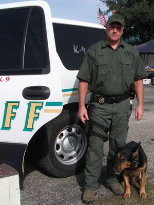 Deputy Tim Patterson and his police K9 Dax.