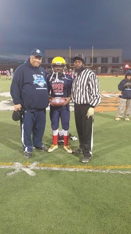 Gastonia's Elijah Burris shows off his MVP award from a Jan. 2 All-American game played in Dallas, Tex.