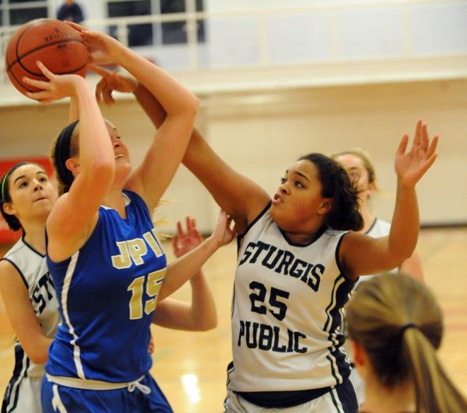 Tori Gibson of St. John Paul II shoot in a game earlier this season against Sturgis East. Gibson scored 20 points in the Lions win over Cape Tech on Friday. Ron Schloerb/Cape Cod Times File