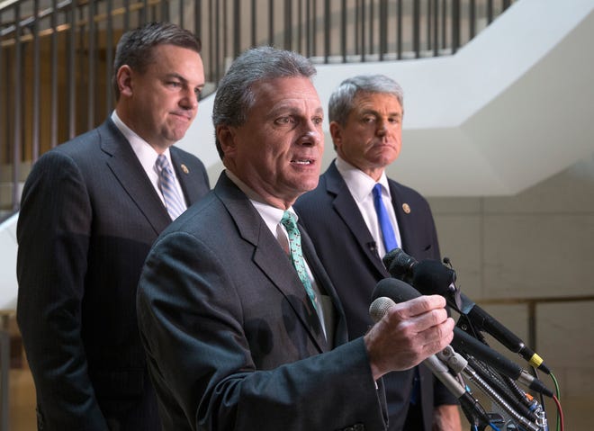 Rep. Buddy Carter R-Ga., center, flanked by House Homeland Security Committee Chairman Rep. Michael McCaul, R-Texas, right, and Rep. Richard Hudson, R-N.C., speaks with reporters on Capitol Hill in Washington on Friday about the arrest of two Iraqi-born men who came to the U.S. as refugees and have been indicted on terrorism-related charges by federal authorities who allege one traveled to Syria to fight with terrorists in the civil war and the other provided support to the Islamic State group.