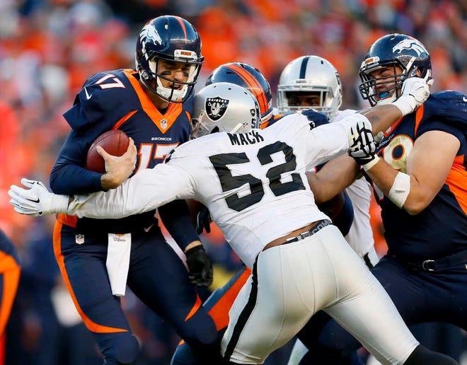 Denver Broncos quarterback Brock Osweiler, left, is sacked by Oakland Raiders defensive end Khalil Mack on Dec. 13 in Denver. Mack is now the first selection at two positions in the same year for the 2015 Associated Press NFL All-Pro Team. (AP Photo/Joe Mahoney)