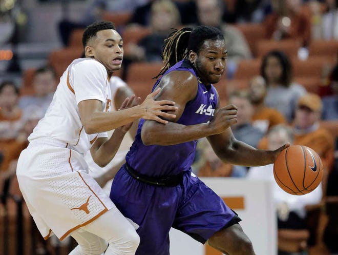 Kansas State forward D.J. Johnson, right, and the Wildcats will look to upset No. 2-ranked Oklahoma on Saturday in Norman. K-State is off to an 0-2 start in Big 12 play.