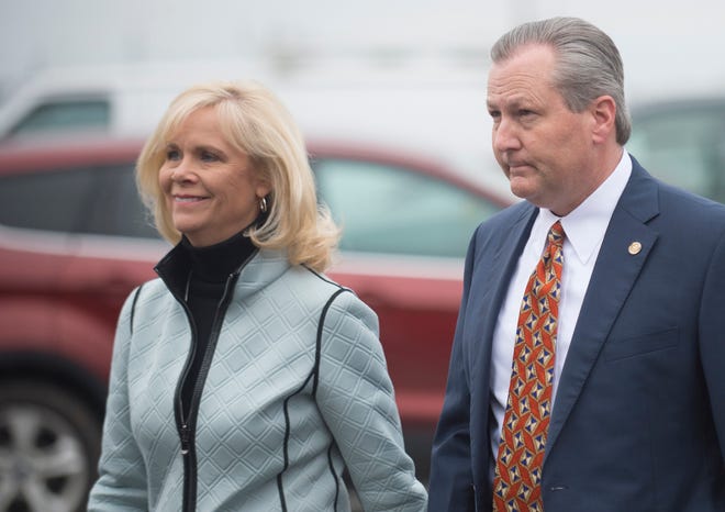 Mike Hubbard and his wife Susan Hubbard walk into the Lee County Justice Center for a hearing on Friday, Jan. 8, 2016, in Opelika, Ala. Lee County Circuit Judge Jacob Walker handed down a gag order to prevent lawyers from speaking to the media in the ethics case against indicted Alabama House Speaker Mike Hubbard. (Albert Cesare/The Montgomery Advertiser via AP) NO SALES; MANDATORY CREDIT