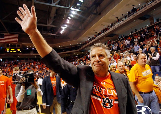 Auburn Coach Bruce Pearl waves to fans after an 83-77 win over Tennessee on Jan. 2. Pearl brings Auburn to Mizzou Arena on Saturday.