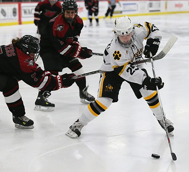 Adrian College junior forward Kristin Lewicki rushes the net during Friday's non-conference game against 
Manhattanville.